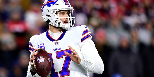 Buffalo Bills quarterback Josh Allen #17 drops back to pass in the first quarter against the New England Patriots at Gillette Stadium on December 1, 2022 in Foxborough, Massachusetts. 