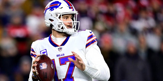 Quarterback Josh Allen #17 of the Buffalo Bills drops back to pass in the first quarter against the New England Patriots at Gillette Stadium on December 01, 2022 in Foxborough, Massachusetts.
