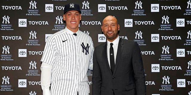 Aaron Judge of the New York Yankees, left, poses for a photo with Derek Jeter during a press conference at Yankee Stadium Dec. 21, 2022, in the Bronx, N.Y. 