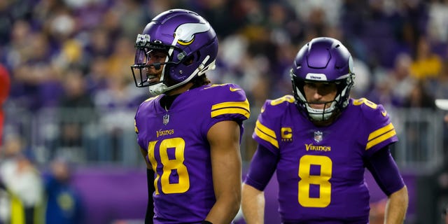 Justin Jefferson (18) and Kirk Cousins ​​(8) of the Minnesota Vikings against the New England Patriots in the second quarter of a game at US Bank Stadium in Minneapolis.  The Vikings defeated the Patriots 33-26.