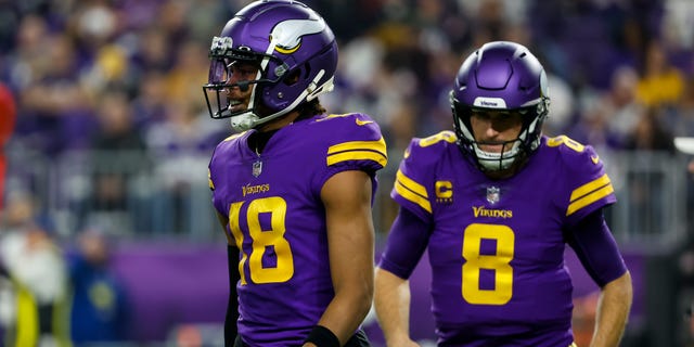 Justin Jefferson (18) and Kirk Cousins ​​(8) of the Minnesota Vikings against the New England Patriots in the second quarter of a game at US Bank Stadium in Minneapolis.  The Vikings defeated the Patriots 33-26.