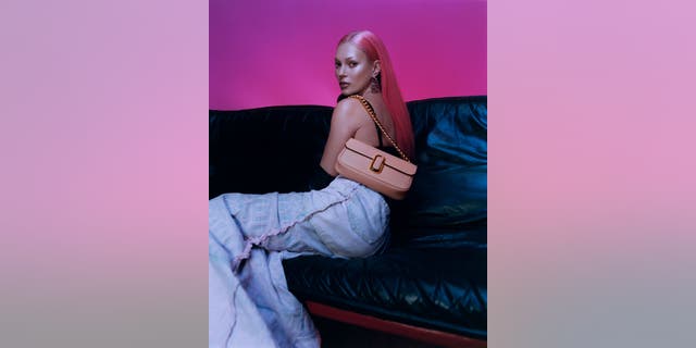 Kate Moss models a Marc Jacobs purse to match her new tresses in latest campaign.