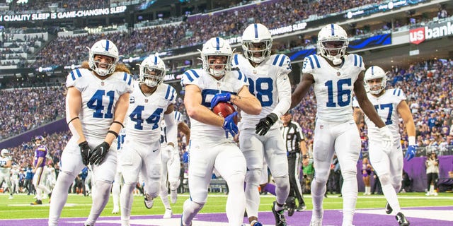 Indianapolis Colts linebacker JoJo Domann (57) celebrates scoring a touchdown during a game against the Minnesota Vikings Dec. 17, 2022, at U.S. Bank Stadium in Minneapolis