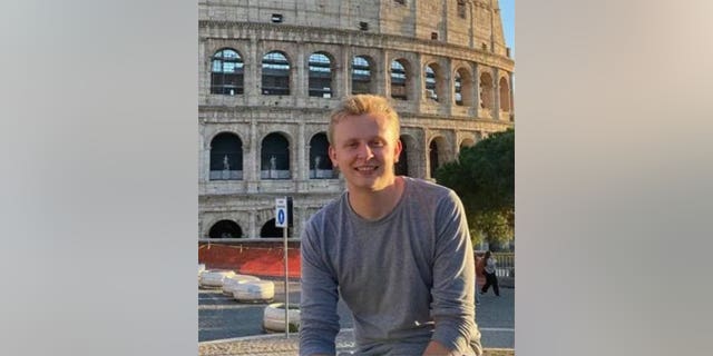 Ken Deland seen smiling in photo while studying abroad in Europe. 