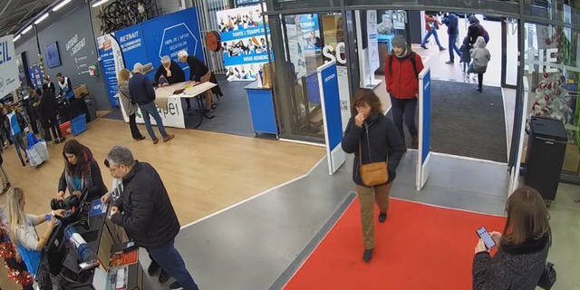 Ken DeLand walking into a a sporting goods store in Montelimar on Dec. 3. 