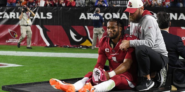 Kyler Murray #1 of the Arizona Cardinals is carried off the field after being injured against the New England Patriots during the first quarter of the game at State Farm Stadium on December 12, 2022 in Glendale, Arizona.