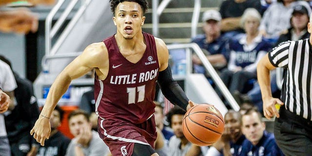 Jaizec Lottie of the Arkansas Little Rock Trojans moves the ball down the court during the game between the Nevada Wolf Pack and the Arkansas Little Rock Trojans at Lawlor Events Center on November 16, 2018 in Reno, Nevada.