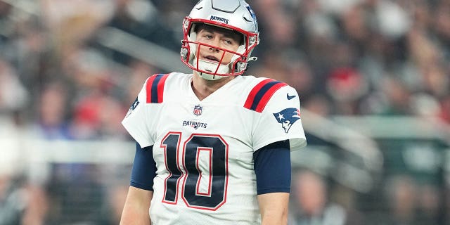 New England Patriots quarterback Mack Jones reacts after a second half play against the Las Vegas Raiders at Allegiant Stadium on Dec. 18, 2022 in Las Vegas. 