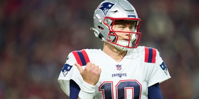 Mac Jones #10 of the New England Patriots looks towards the sideline against the Arizona Cardinals during the first half at State Farm Stadium on December 12, 2022 in Glendale, Arizona.