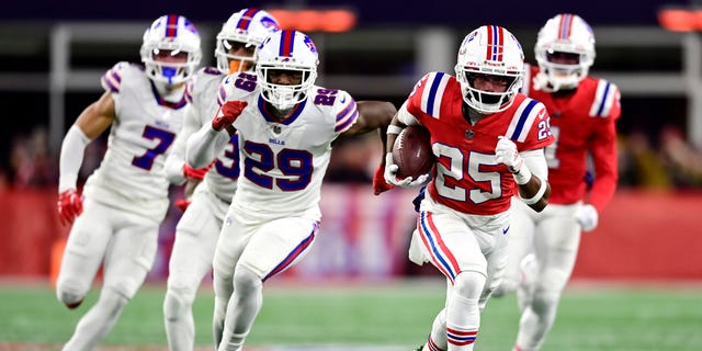 New England Patriots' Marcus Jones (25) runs for a touchdown in the first quarter against the Buffalo Bills at Gillette Stadium on December 1, 2022 in Foxborough, Massachusetts. 