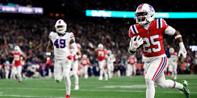 New England Patriots' Marcus Jones (25) runs for a touchdown in the first quarter against the Buffalo Bills at Gillette Stadium on December 1, 2022 in Foxborough, Massachusetts.