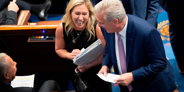 Rep. Marjorie Taylor Greene, R-Ga., left, speaks with House Minority Leader Kevin McCarthy, R-Calif., as the House votes on creating a January 6th Committee at the U.S. House Chamber of the U.S. Capitol in Washington on Wednesday, June 30, 2021. (Photo by Caroline Brehman/CQ-Roll Call, Inc via Getty Images)