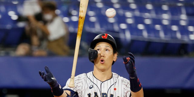 Outfielder Masataka Yoshida #34 of Team Japan reacts while at bat in the sixth inning against Team USA during the Gold Medal Game between Team USA and Team Japan on the fifteenth day of the Tokyo 2020 Olympic Games at Yokohama Baseball Stadium on August 07, 2021 in Yokohama, Kanagawa, Japan.