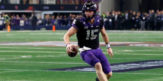 Max Duggan, #15 of the TCU Horned Frogs, carries the ball against the Kansas State Wildcats in the second half of the Big 12 Football Championship at AT&T Stadium on Dec. 3, 2022 in Arlington, Texas. 