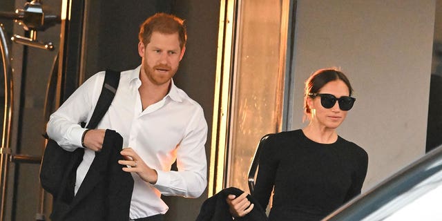 Prince Harry and Meghan Markle are photographed in New York City on Monday.