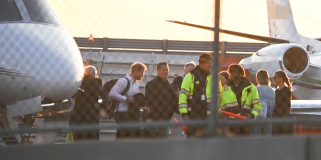 Prince Harry and Meghan Markle are pictured departing a private jet in New York City on Monday.