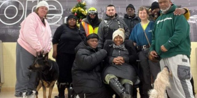 Jay Withey, center, is pictured surrounded by some of the people he helped find shelter from the deadly winter storm in Western New York last weekend. 