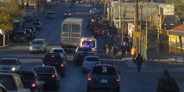 Part of the group of migrants walking to the border after they were dropped off at non-governmental organizations in Ciudad Juarez.