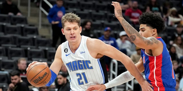 Moritz Wagner, #21 of the Orlando Magic, handles the ball against Killian Hayes, #7 of the Detroit Pistons, during the first quarter at Little Caesars Arena on Dec. 28, 2022 in Detroit.