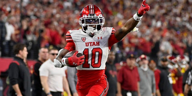 Money Parks #10 of the Utah Utes celebrates as he scores a 57-yard touchdown against the USC Trojans during the third quarter in the Pac-12 Championship at Allegiant Stadium on Dec. 02, 2022 in Las Vegas, Nev. 