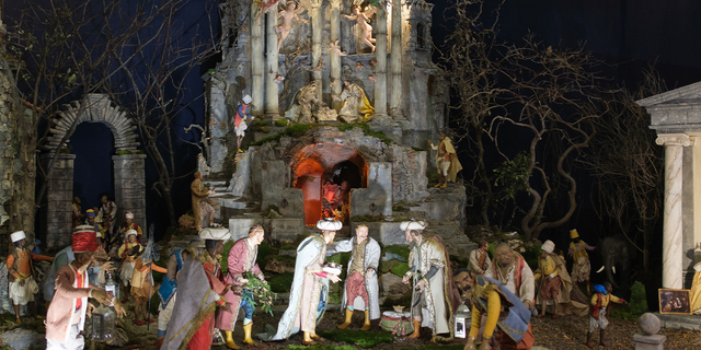 Several figures representing a scene of the birth of Christ are shown in the traditional Christmas nativity scene of Neapolitan origin from the 19th century.