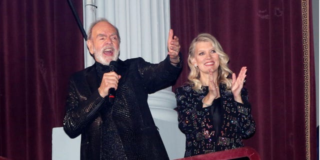 Neil Diamond gives a surprise performance of "Sweet Caroline" on the opening night of "A Beautiful Noise, The Neil Diamond Musical" on Sunday.