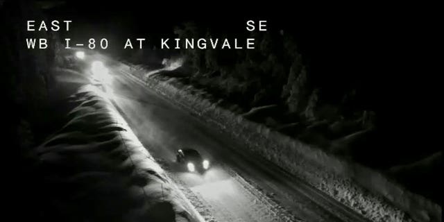 Interstate-80 in Northern California is seen covered with snow on Sunday night.