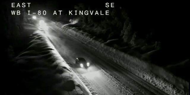 Interstate-80 in Northern California is seen covered with snow on Sunday night.