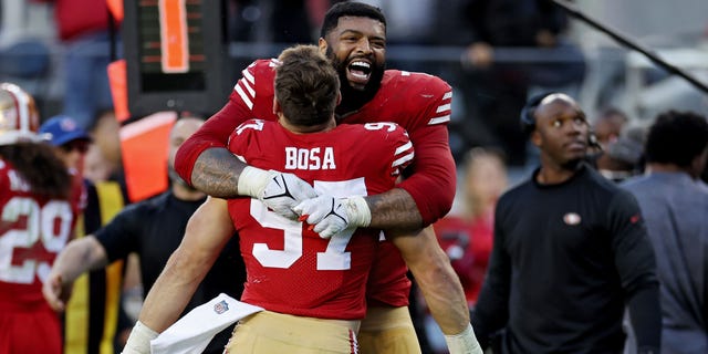 Trent Williams of the San Francisco 49ers hugs Nick Bosa during the fourth quarter against the Miami Dolphins at Levi's Stadium on Dec. 4, 2022, in Santa Clara, California.