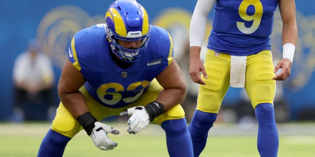 Matthew Stafford #9 of the Los Angeles Rams sets up in the shotgun behind Brian Allen #55 and Oday Aboushi #63 during a 31-14 loss to the San Francisco 49ers at SoFi Stadium on October 30, 2022 in Inglewood, California. 