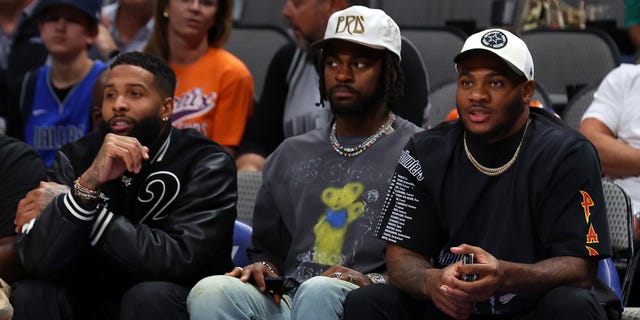 Odell Beckham Jr. attends the NBA game between the Phoenix Suns and Dallas Mavericks with Dallas Cowboys Micah Parsons and Trevon Diggs at American Airlines Center on December 05, 2022 in Dallas, Texas.