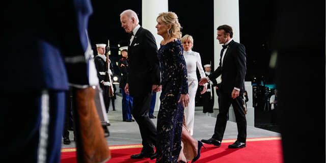 President Joe Biden and first lady Jill Biden welcome French President Emmanuel Macron and his wife Brigitte Macron as they arrive for a State Dinner on the North Portico of the White House, on Dec. 1, 2022. 