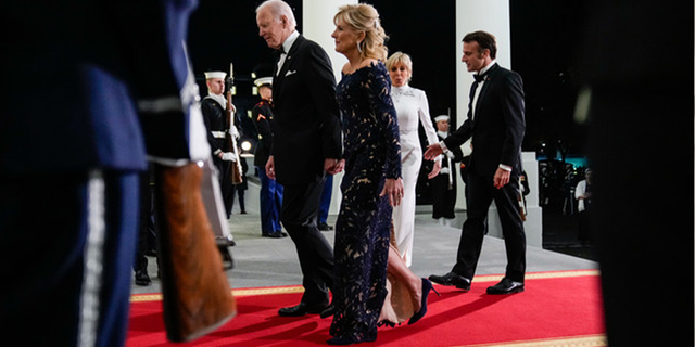 President Joe Biden and first lady Jill Biden welcome French President Emmanuel Macron and his wife Brigitte Macron as they arrive for a State Dinner on the North Portico of the White House, on Dec. 1, 2022. 