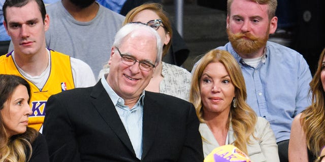 Phil Jackson and Jeanie Buss attend a basketball game between the New York Knicks and the Los Angeles Lakers at Staples Center on March 12, 2015 in Los Angeles, California.