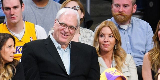 Phil Jackson and Jeanie Buss attend a basketball game between the New York Knicks and the Los Angeles Lakers at Staples Center on March 12, 2015 in Los Angeles, California.