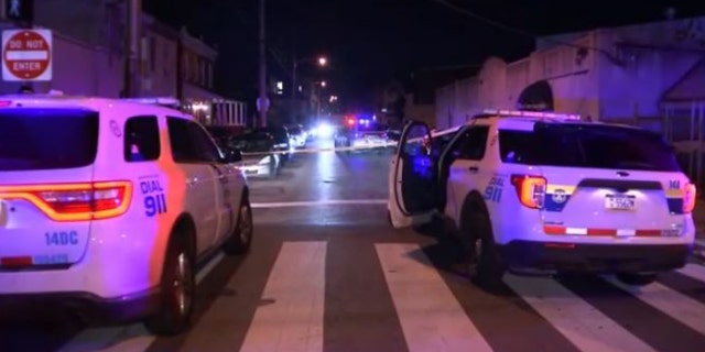 Police investigate a shooting scene where 39-year-old Maisah Larkin was found shot in the head on the first floor of a living room in her home on the 1800 block of E Haines Street around 8:08 p.m. on Sunday.