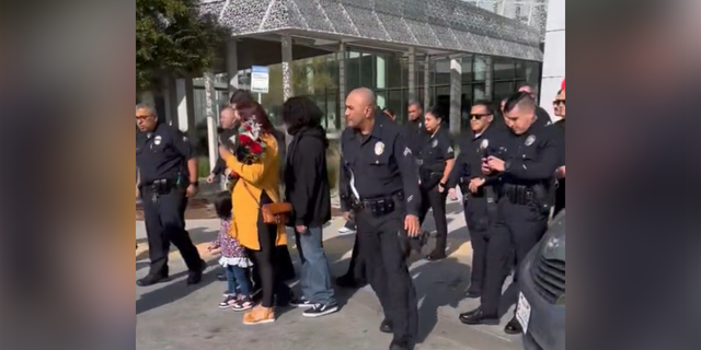 Los Angeles Police Department Capt. E. Morales posted a video on Twitter showing the boy exiting the hospital and walking toward a police cruiser as his family followed carrying balloons.