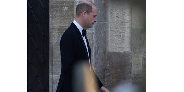 Prince William wore a black suit at his ex-girlfriend's wedding on Saturday.