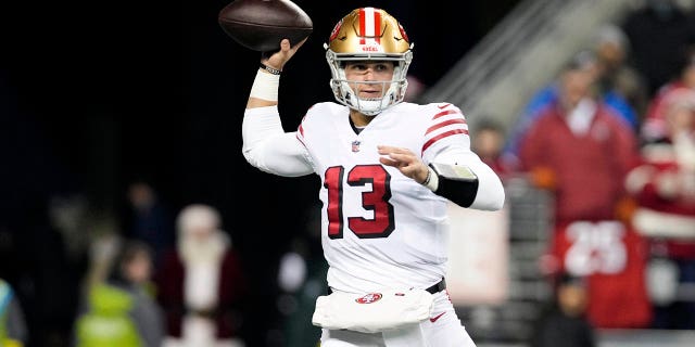 Brock Purdy #13 of the San Francisco 49ers throws a pass against the Seattle Seahawks during the first half at Lumen Field on December 15, 2022 in Seattle, Washington.