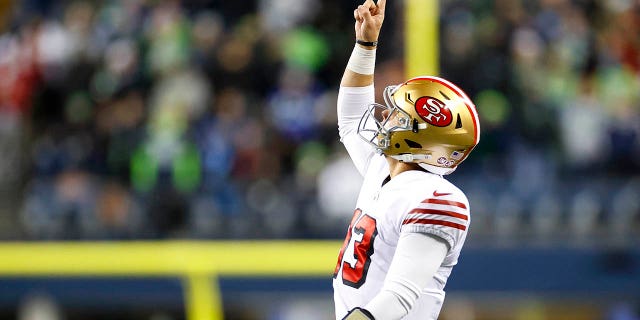 Brock Purdy #13 of the San Francisco 49ers celebrates after a touchdown against the Seattle Seahawks during the third quarter of the game at Lumen Field on December 15, 2022 in Seattle, Washington. 