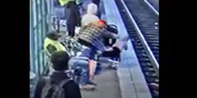 Video appeared to show the suspect jumping up from a beach and pushing the 3-year-old onto the tracks. 