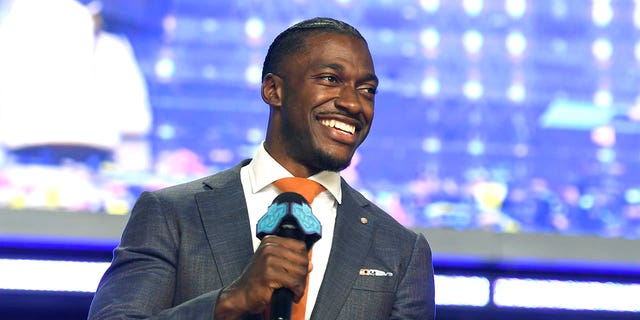 Robert Griffin III speaks onstage during round four of the 2022 NFL Draft on April 30, 2022 in Las Vegas, Nevada. 