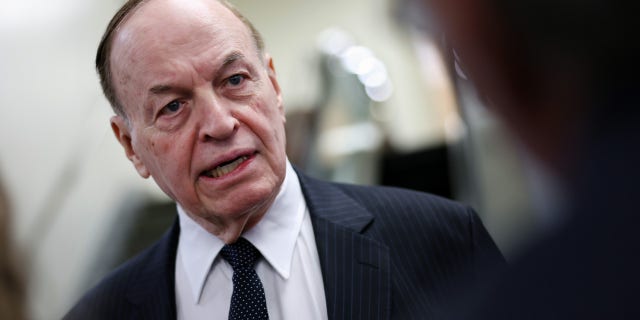 Sen. Richard Shelby, R-Ala., talks to reporters on his way to the Senate weekly policy luncheons, at the U.S. Capitol on Dec. 6, 2022, in Washington, D.C.