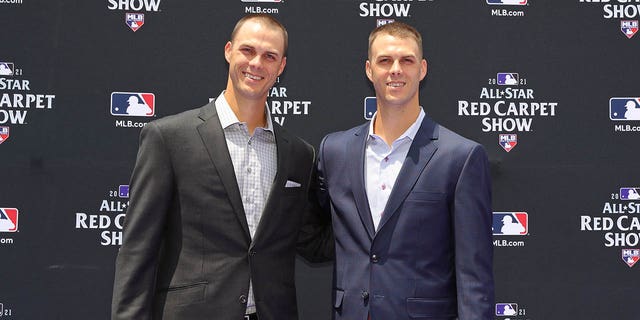 Taylor Rogers, #55 of the Minnesota Twins, poses for a photo with his twin brother, Tyler Rogers, #71 of the San Francisco Giants, during the MLB All-Star Red Carpet Show at Downtown Colorado on Tuesday, July 13, 2021, in Denver, Colorado. 
