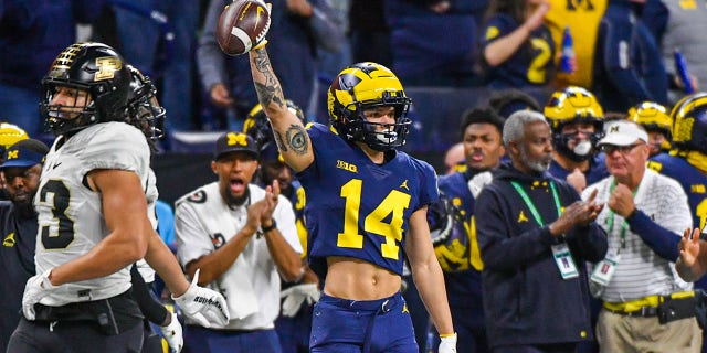 Roman Wilson #14 of the Michigan Wolverines reacts after catching a pass during the first half of the Big Ten football championship game against the Purdue Boilermakers at Lucas Oil Stadium on Dec. 03, 2022 in Indianapolis, Ind.