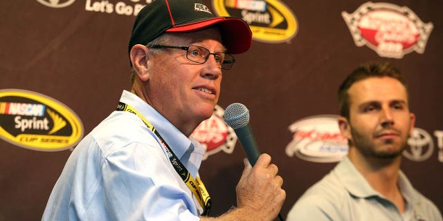 Matt DiBenedetto, driver of the No. 83 E.J. Wade Construction Toyota, right, and BK Racing owner Ron Devine speak with the media at Richmond International Raceway on April 22, 2016, in Richmond, Virginia.