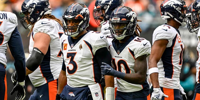 Russell Wilson (3) and Jerry Jeudy (10) of the Denver Broncos defeat the Jacksonville Jaguars in the first quarter on October 30, 2022 at Wembley Stadium in London. 