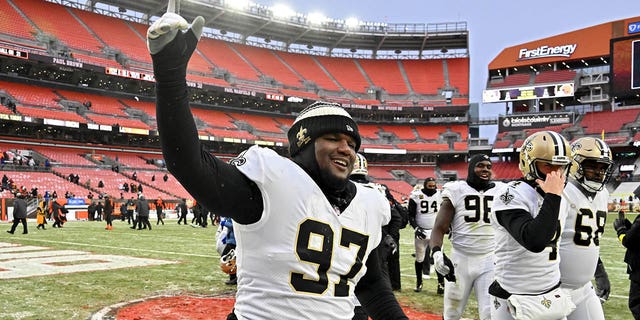 Malcolm Roach #97 of the New Orleans Saints celebrates after a win over the Cleveland Browns at FirstEnergy Stadium on December 24, 2022 in Cleveland, Ohio.