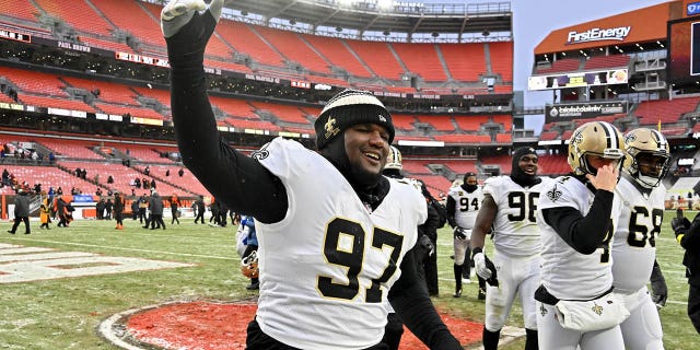 Malcolm Roach #97 of the New Orleans Saints celebrates after a win over the Cleveland Browns at FirstEnergy Stadium on December 24, 2022 in Cleveland, Ohio.