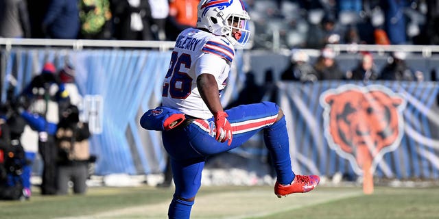 Devin Singletary #26 of the Buffalo Bills celebrates after a touchdown during the third quarter in the game against the Chicago Bears at Soldier Field on December 24, 2022 in Chicago, Illinois.